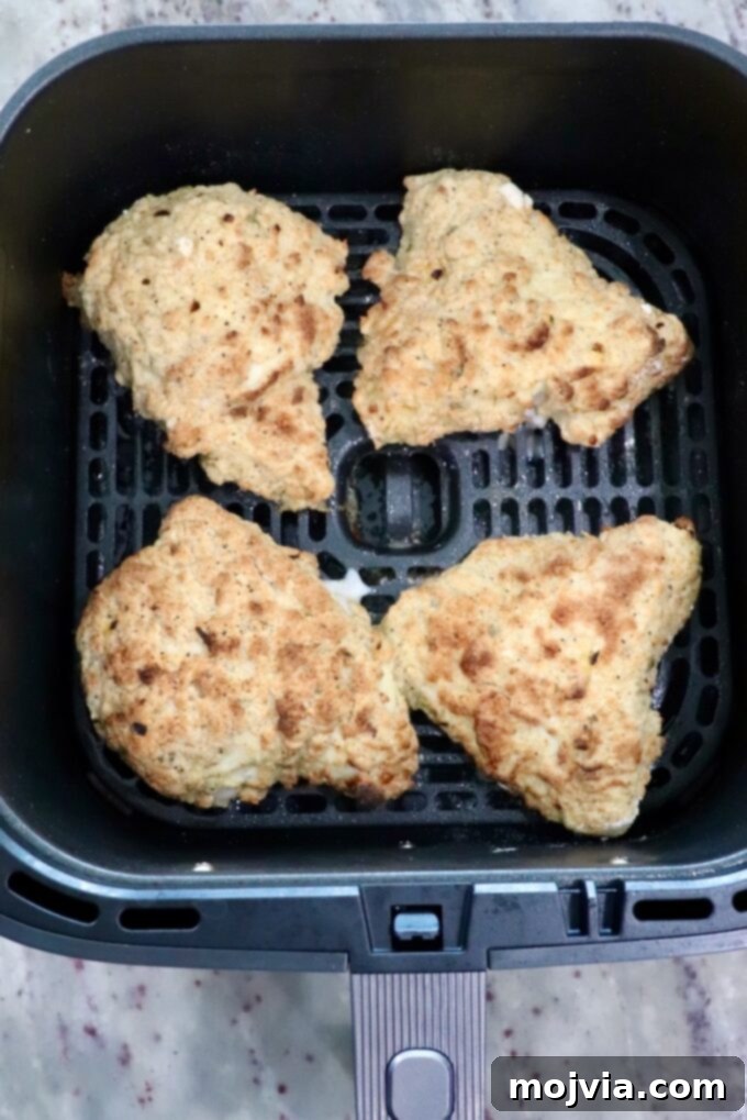 Crispy Air-Fried Chicken Sandwich 11 cooked pieces of chicken in an air fryer basket