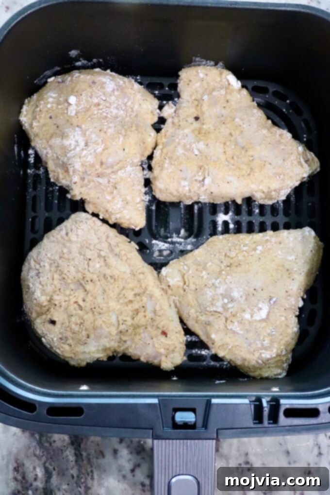 Crispy Air-Fried Chicken Sandwich 10 breaded chicken in an air fryer basket