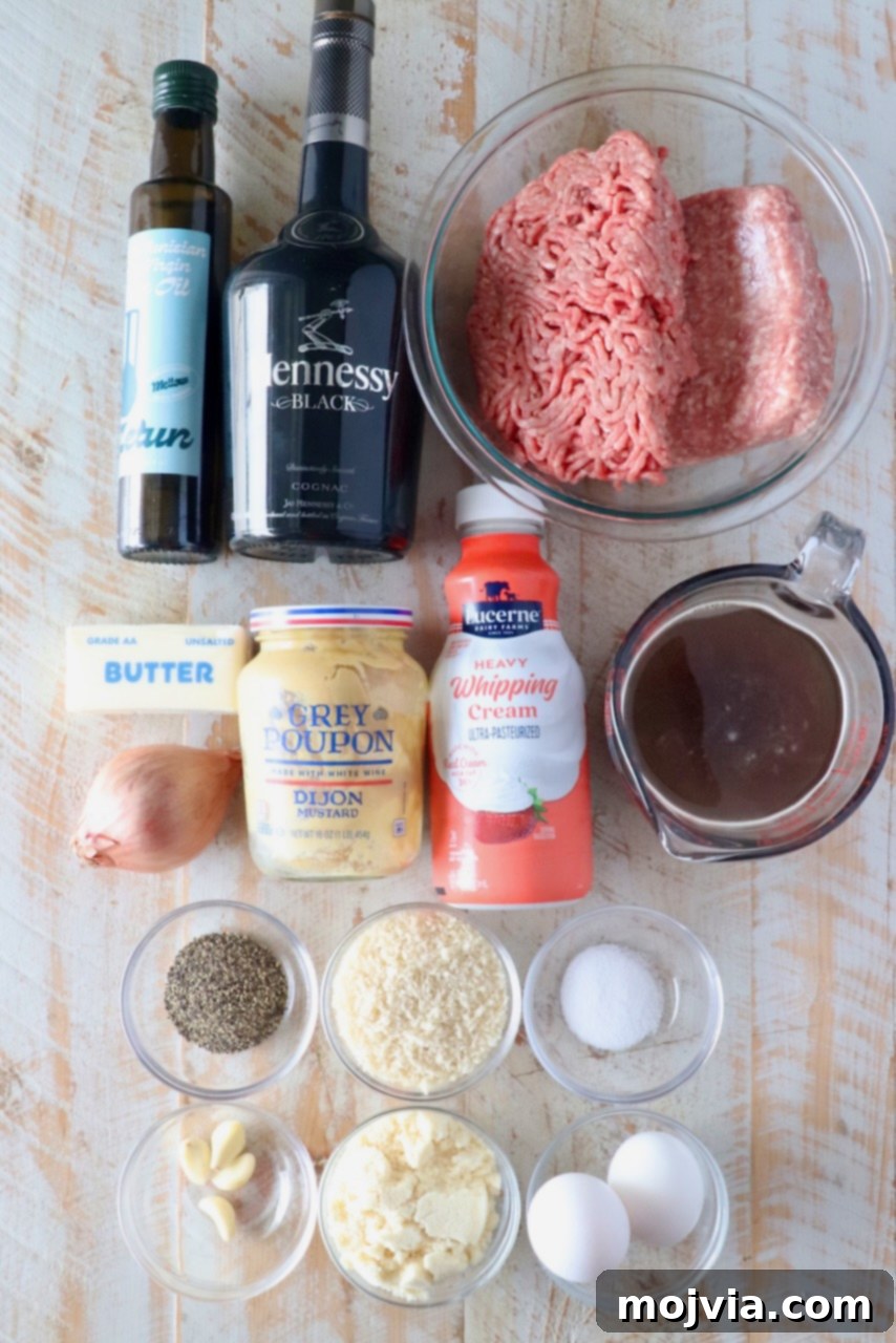 Creamy Peppercorn Meatballs 3 Ingredients for a recipe displayed on a wooden surface include olive oil, Hennessy, ground meat, cream, broth, butter, mustard, eggs, spices, and garlic.