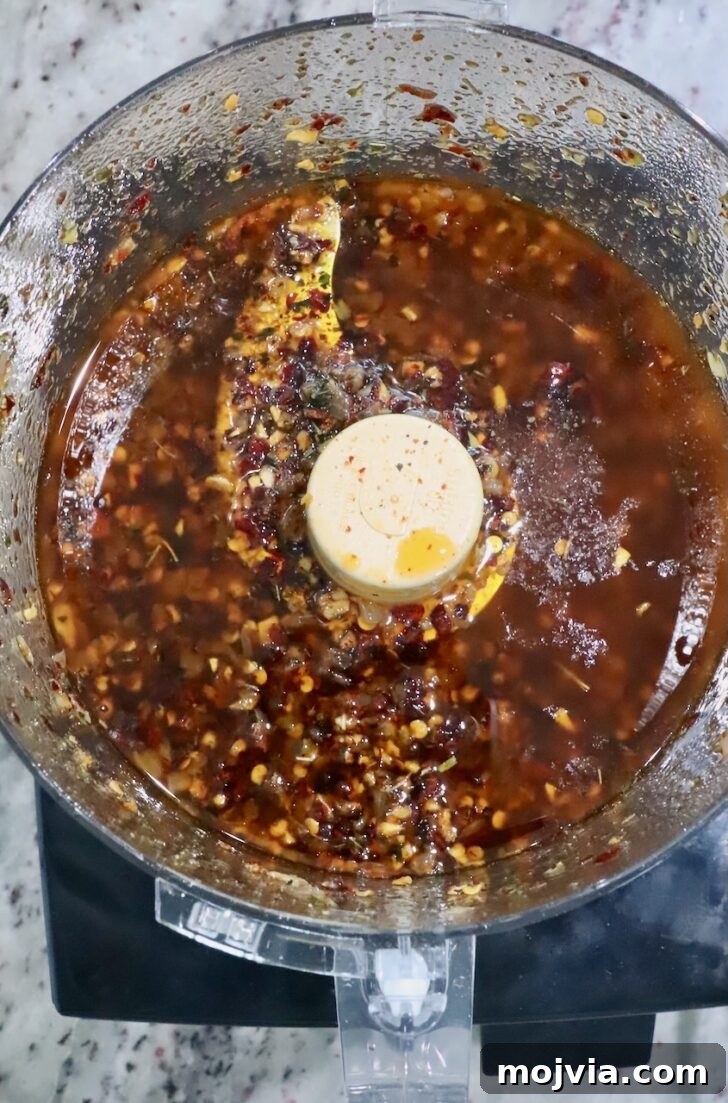 Calabrian Chili Crisp: Spicy Oil Recipe & Flavor Uses 11 Calabrian chili crisp in a food processor