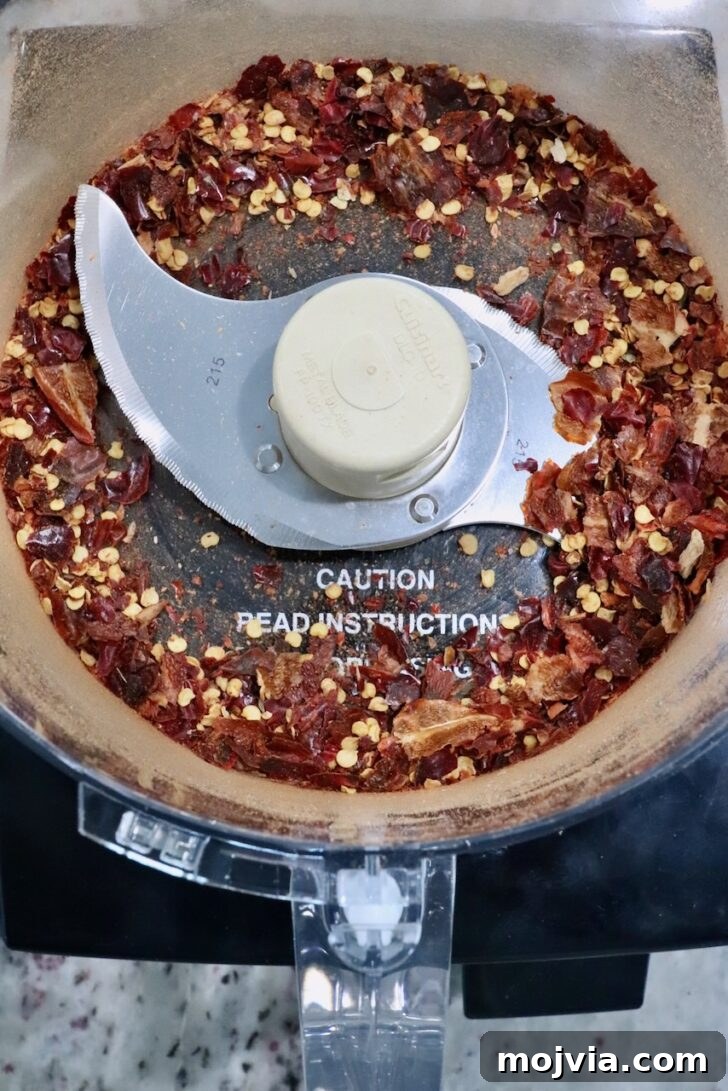 Calabrian Chili Crisp: Spicy Oil Recipe & Flavor Uses 6 chopped dried chili peppers in a food processor