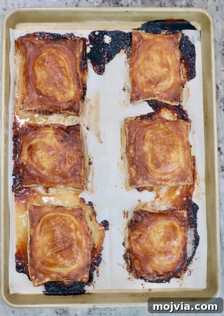 Gorgonzola and Pear Tart Recipe: Savory-Sweet Rustic Tart 14 baked upside-down tarts on a parchment-lined baking sheet
