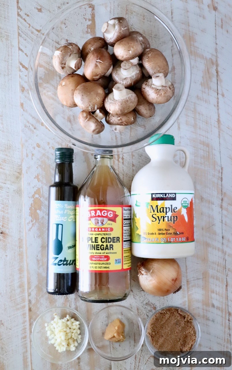 Savory Mushroom Jam Recipe for Spreading and Cooking 5 ingredients on a white wood board for mushroom jam, includes a bowl of mushrooms, maple syrup, apple cider vinegar, olive oil, onion, garlic, miso paste, and brown sugar in a small bowl