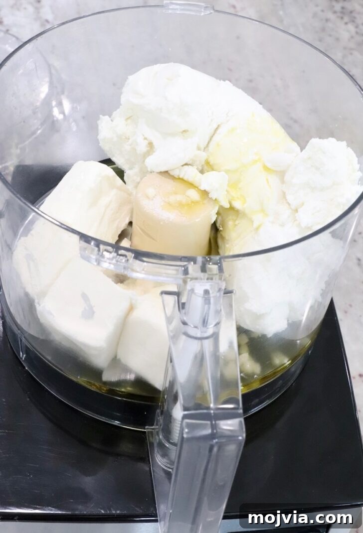 Whipped Goat Cheese Dip Recipe for Entertaining and Snacks 6 goat cheese, cream cheese, garlic and olive oil in a food processor