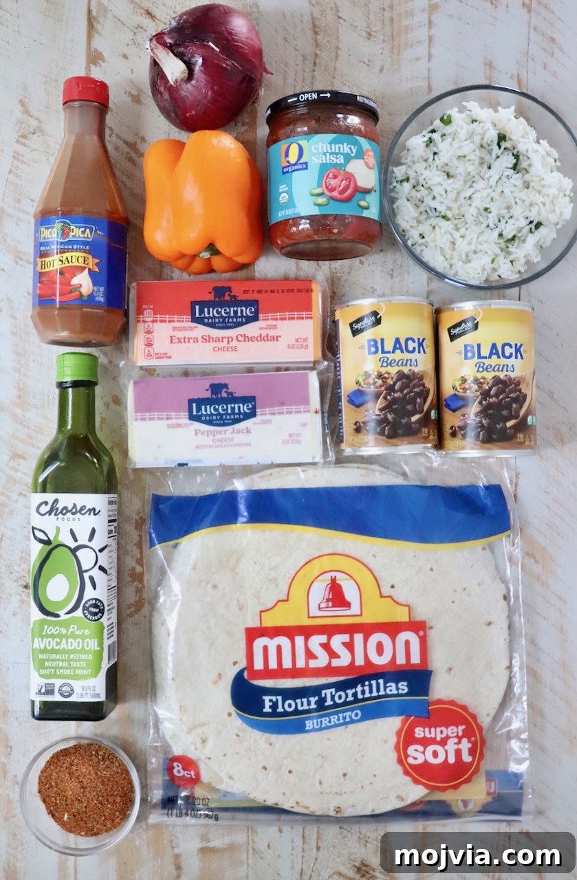 Melted Cheese, Beans & Rice Burrito Recipe for Weeknights 5 ingredients for cheesy bean and rice burritos on a white wood board