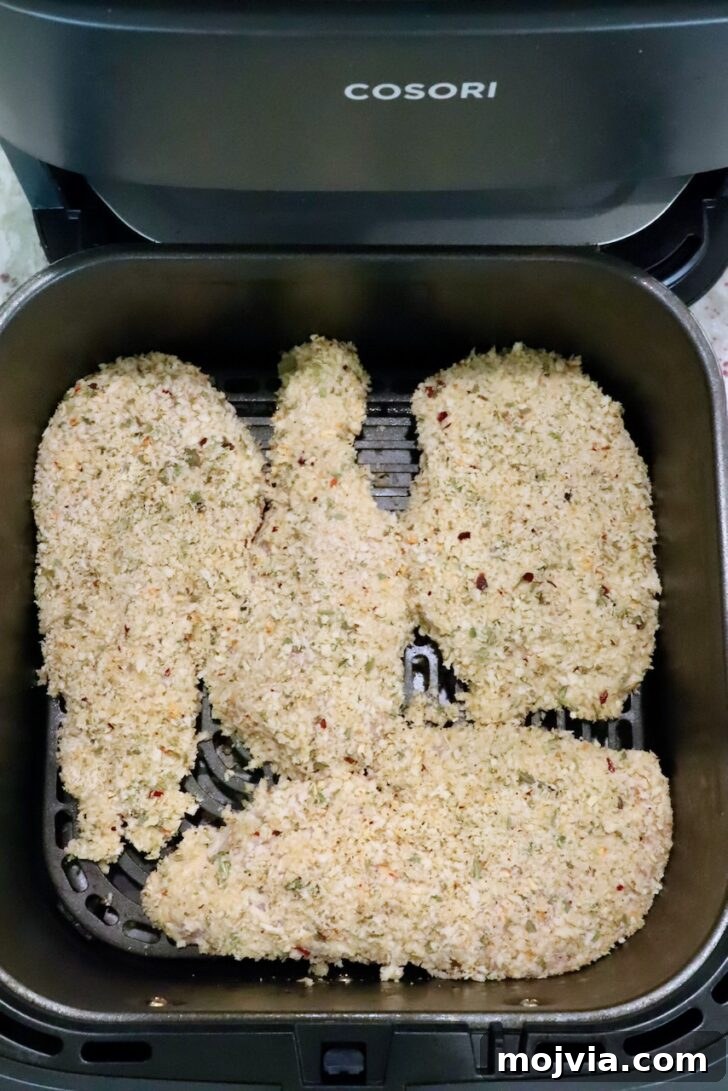 Creamy Chicken Caesar Pasta Recipe for Weeknight Dinners 8 breaded chicken breasts in an air fryer basket