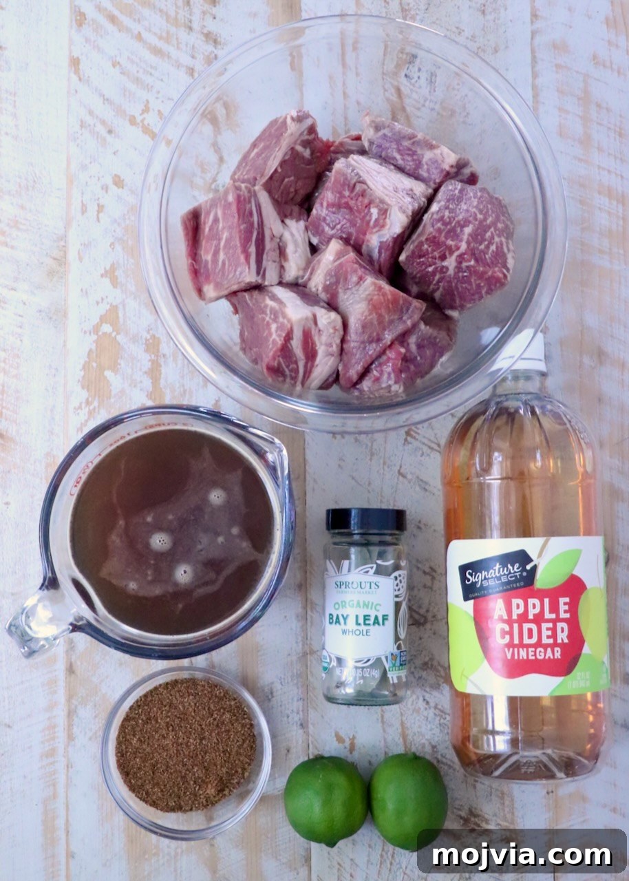 Instant Pot Beef Barbacoa: Tender Mexican Shredded Beef 5 ingredients for beef barbacoa on a white wood board