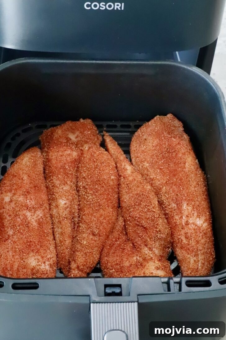 Spicy Buffalo Chicken Salad with Blue Cheese Dressing 6 seasoned chicken breasts in an air fryer basket
