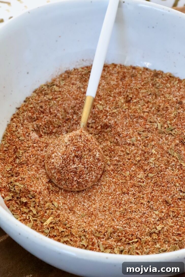 Homemade Chicken Taco Seasoning Mix for Flavorful Tacos 6 chicken taco seasoning in a bowl with a spoon