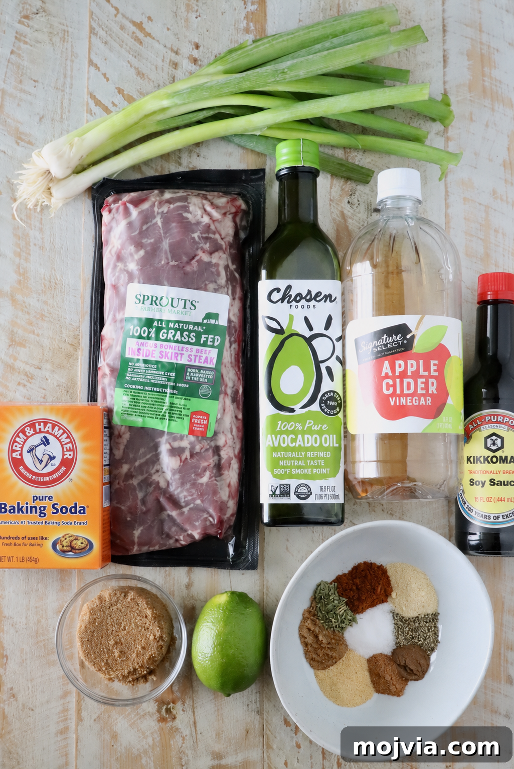 Authentic Jamaican Jerk Steak Recipe 5 ingredients for jerk steak on a white wood board