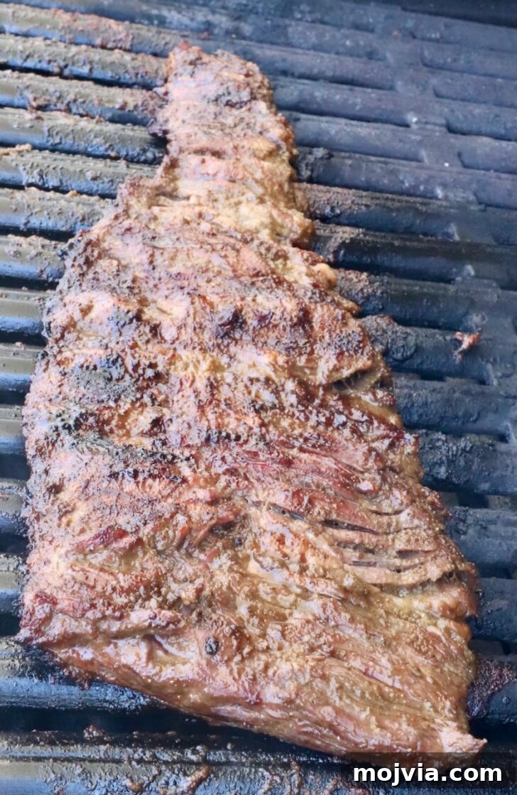 Authentic Jamaican Jerk Steak Recipe 7 grilled skirt steak on a grill